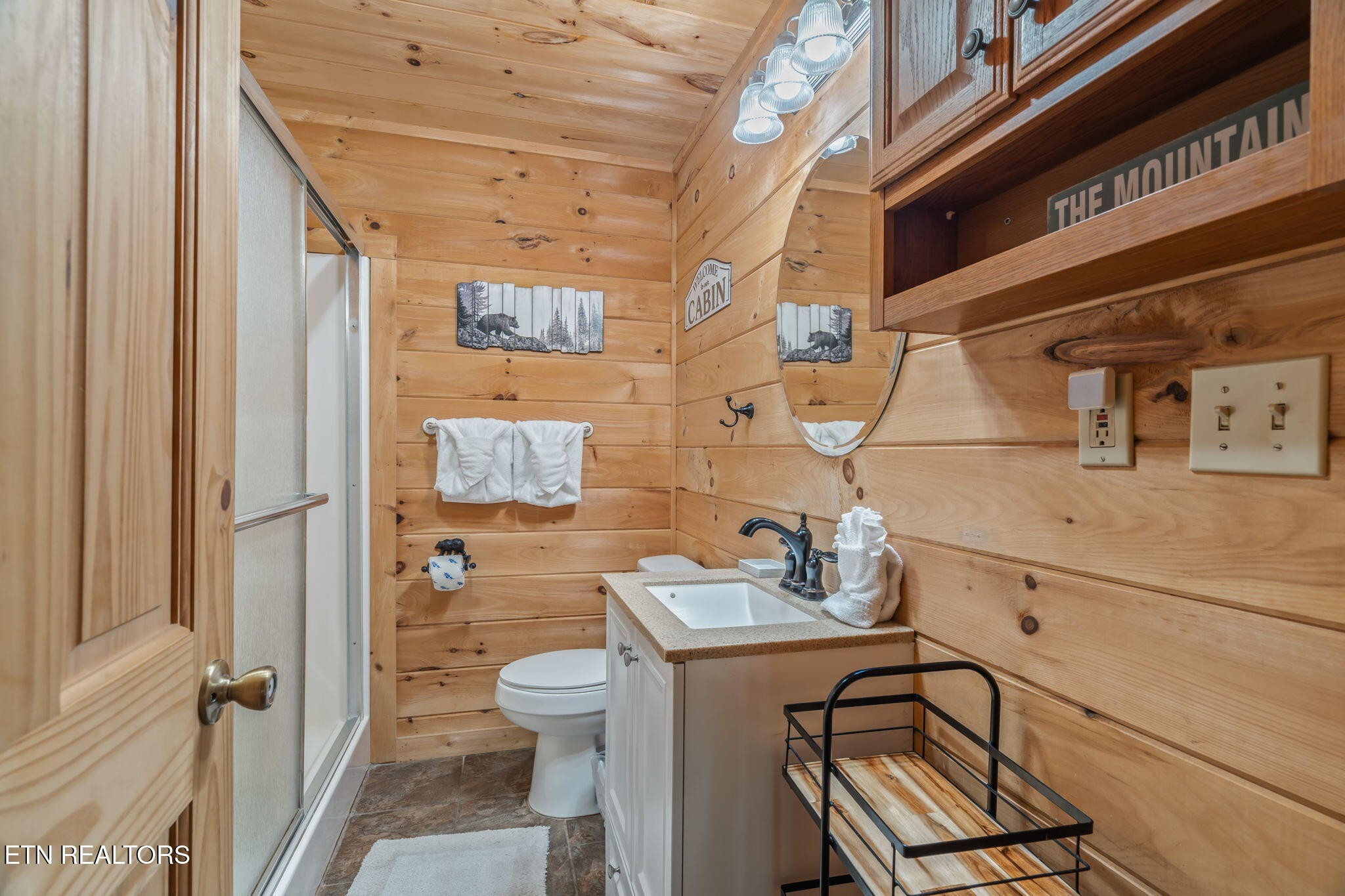 1723 Springer Road Sevierville, TN 37862 - Photo 30 of 43 a bathroom with a sink mirror vanity and toilet