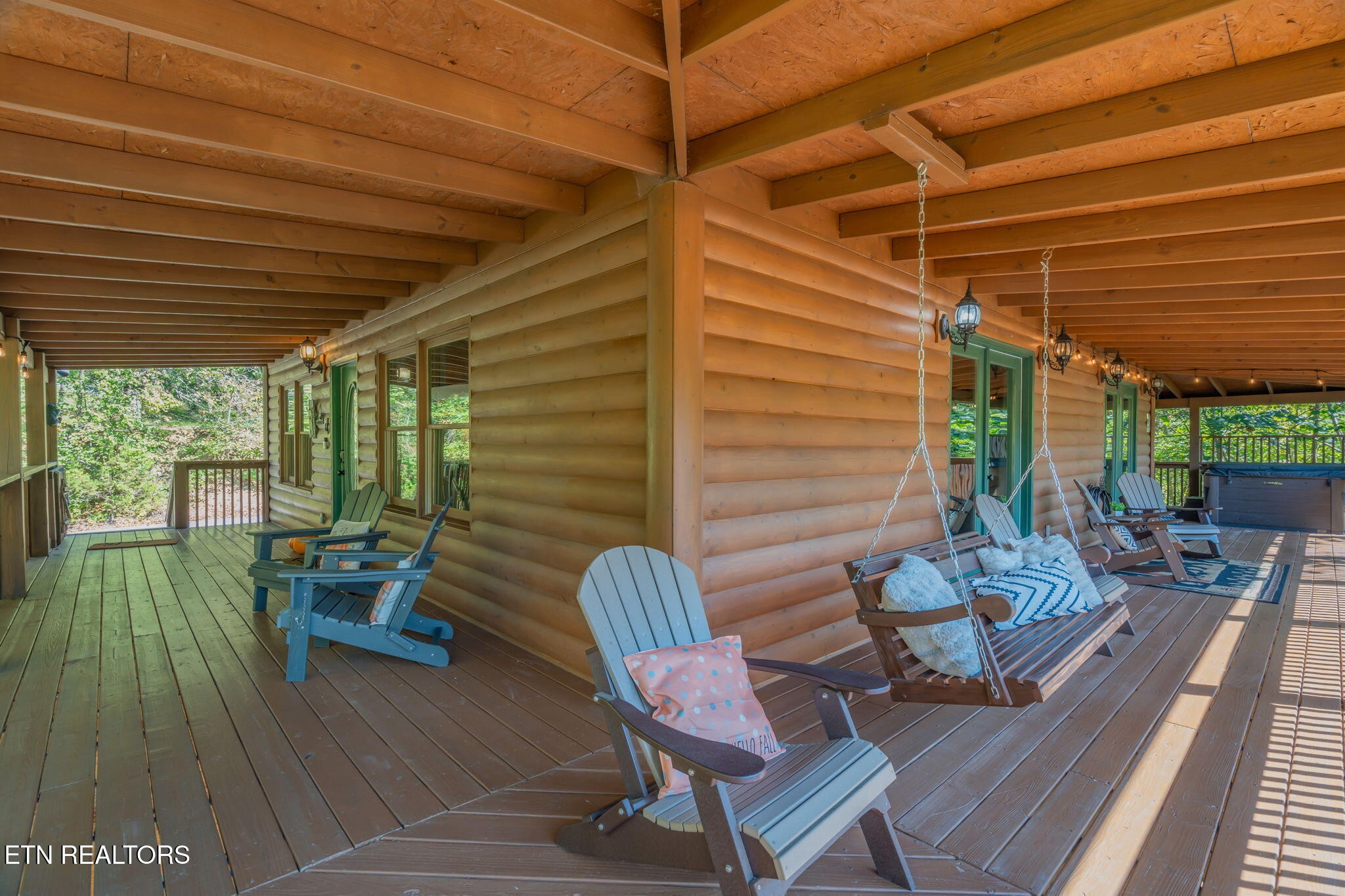 1723 Springer Road Sevierville, TN 37862 - Photo 3 of 43 a balcony with furniture and wooden floor