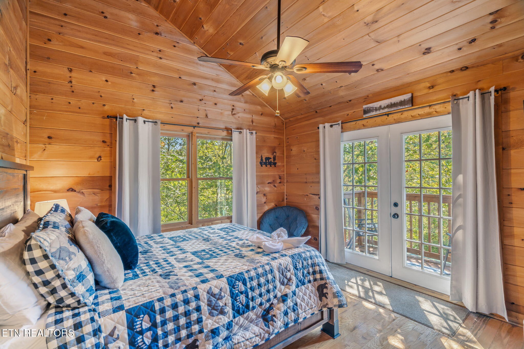 1723 Springer Road Sevierville, TN 37862 - Photo 35 of 43 a bed sitting in a bedroom next to a window