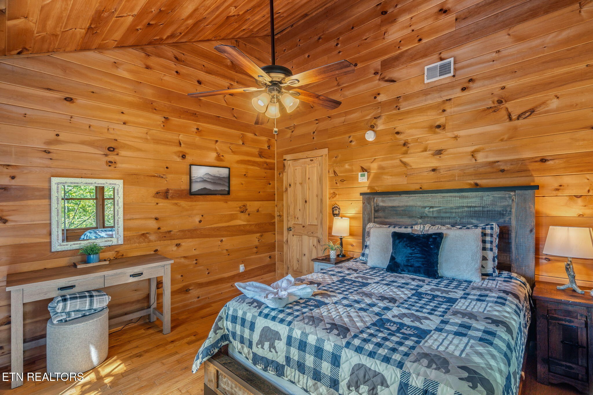 1723 Springer Road Sevierville, TN 37862 - Photo 36 of 43 a bedroom with a bed and a fireplace