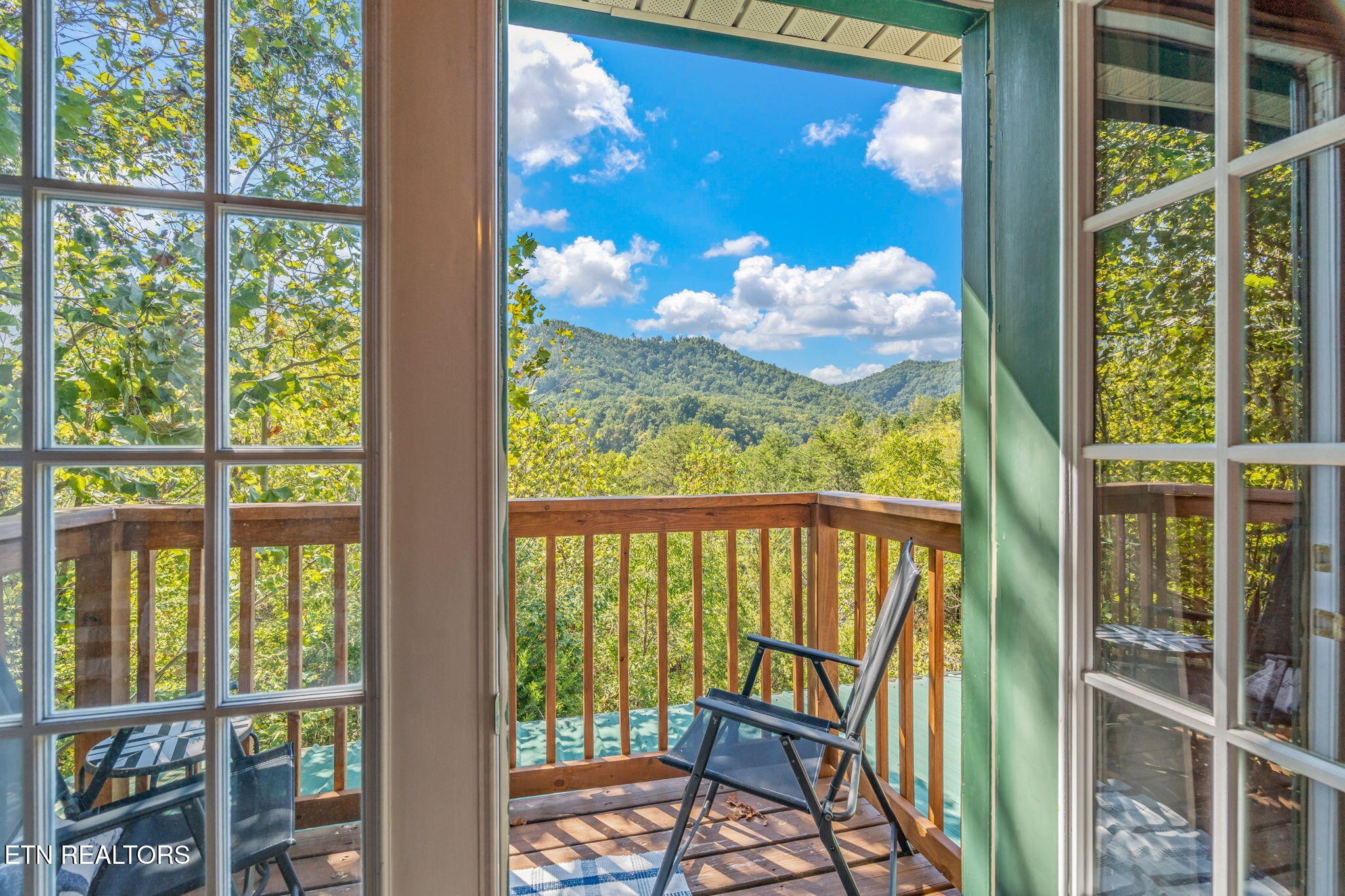 1723 Springer Road Sevierville, TN 37862 - Photo 38 of 43 a view of a balcony with a swing