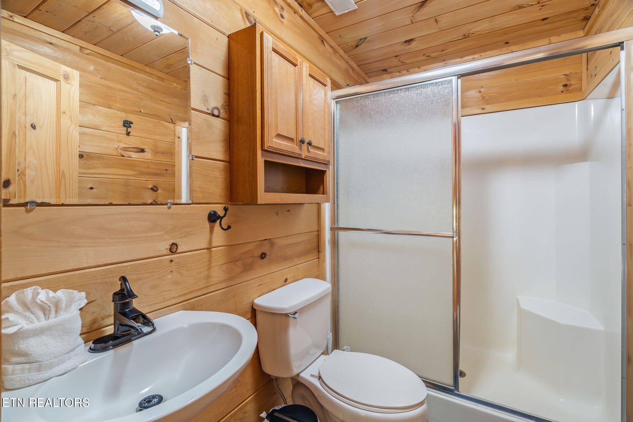 1723 Springer Road Sevierville, TN 37862 - Photo 39 of 43 a bathroom with a sink a toilet and shower