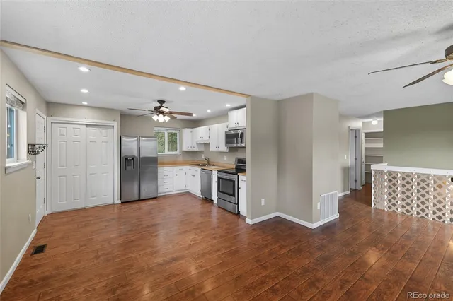 a view of room with window and ceiling fan
