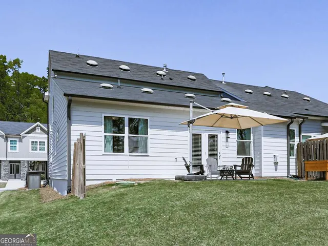 front view of a house with a backyard