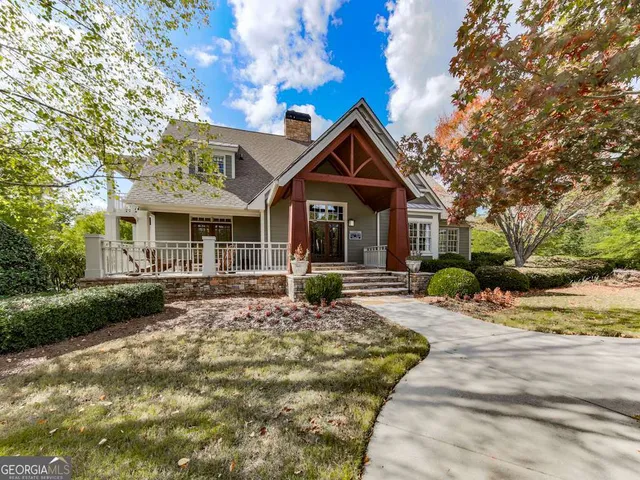 an aerial view of a fireplace with table and chairs