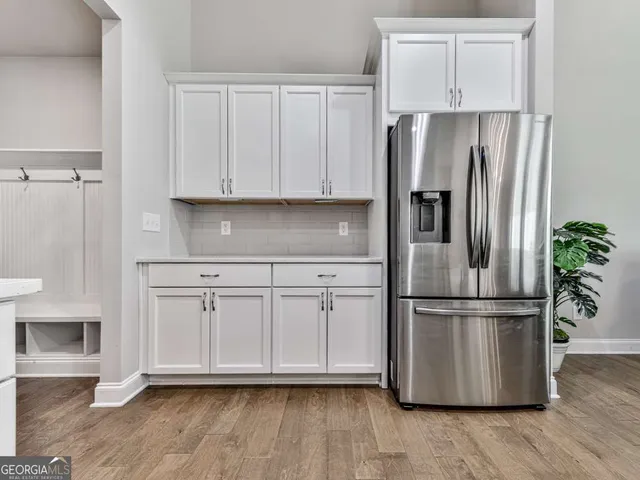 a kitchen with cabinets and stainless steel appliances