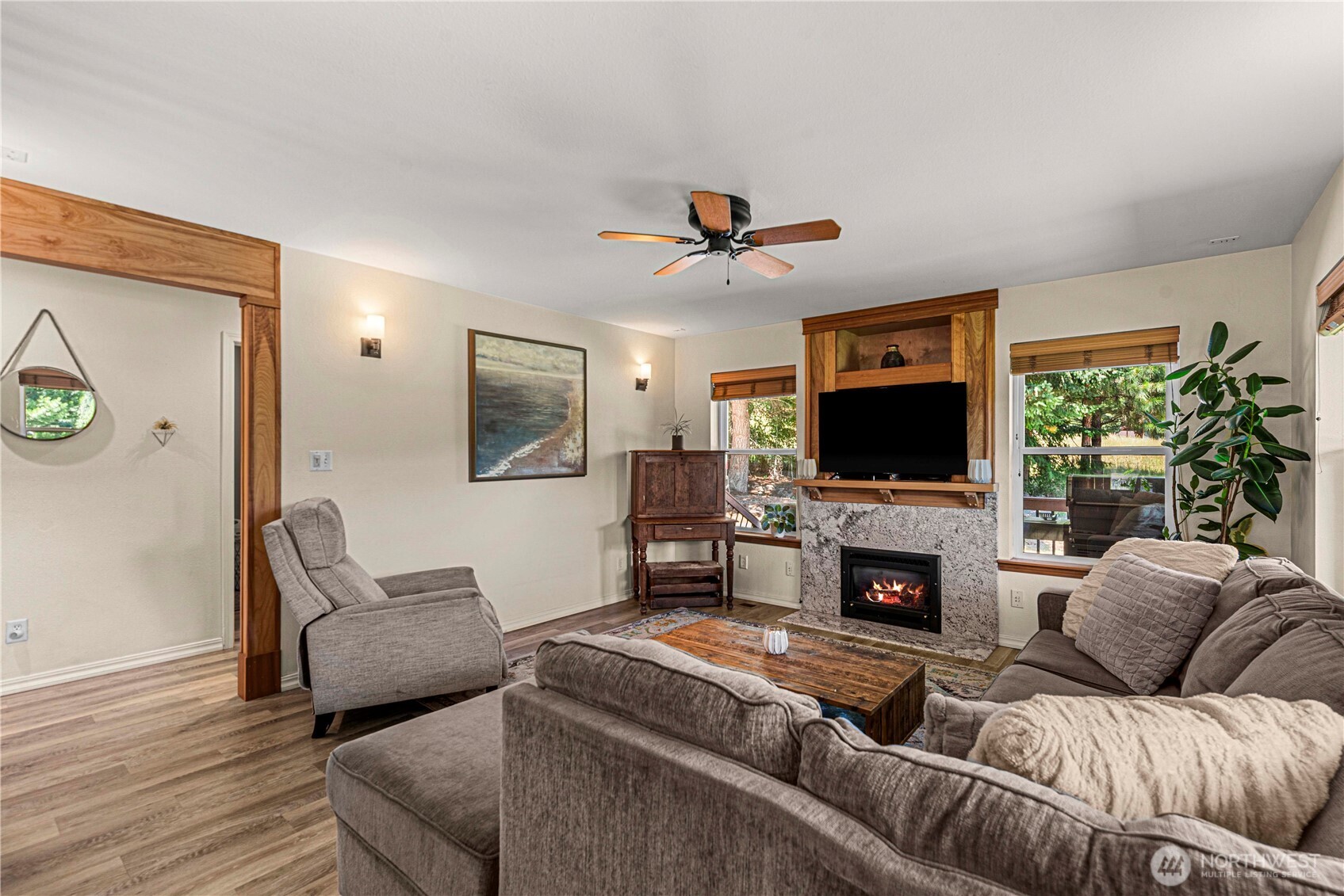 17558 River Road Leavenworth, WA 98826 - Photo 11 of 35 a living room with furniture a flat screen tv and a fireplace