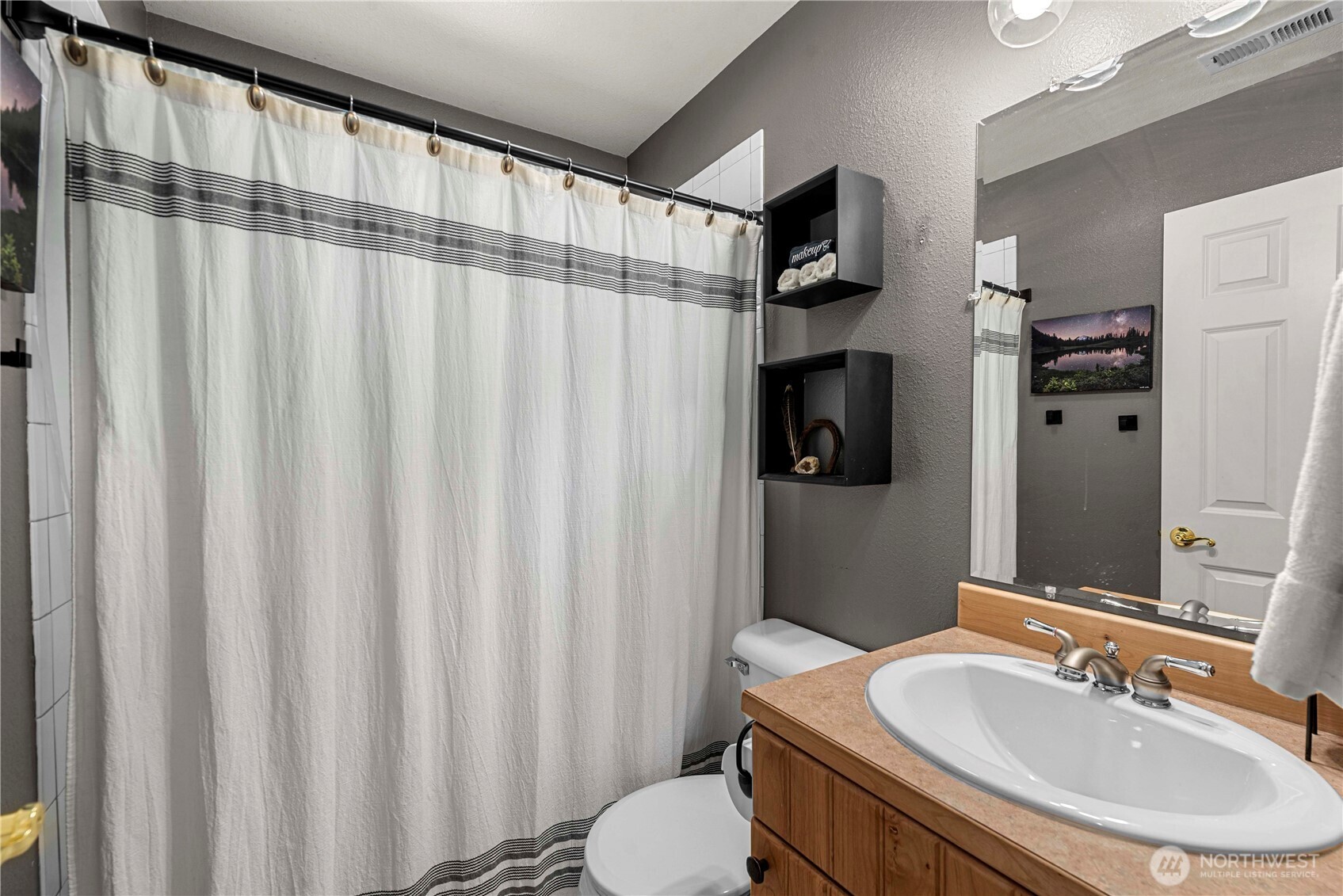 17558 River Road Leavenworth, WA 98826 - Photo 27 of 35 a bathroom with a sink toilet and shower