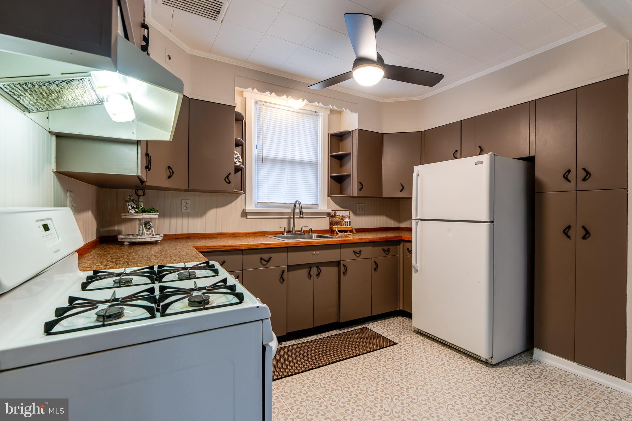 609 Lawn Reading, PA 19609 - Photo 15 of 34 a kitchen with refrigerator a stove a sink dishwasher and a refrigerator