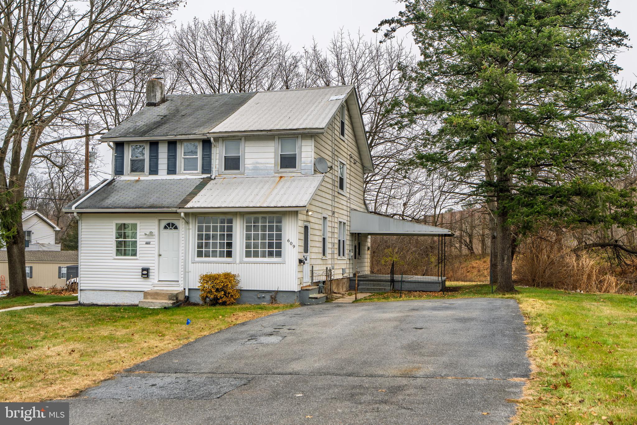 609 Lawn Reading, PA 19609 - Photo 2 of 34 a front view of a house with a yard