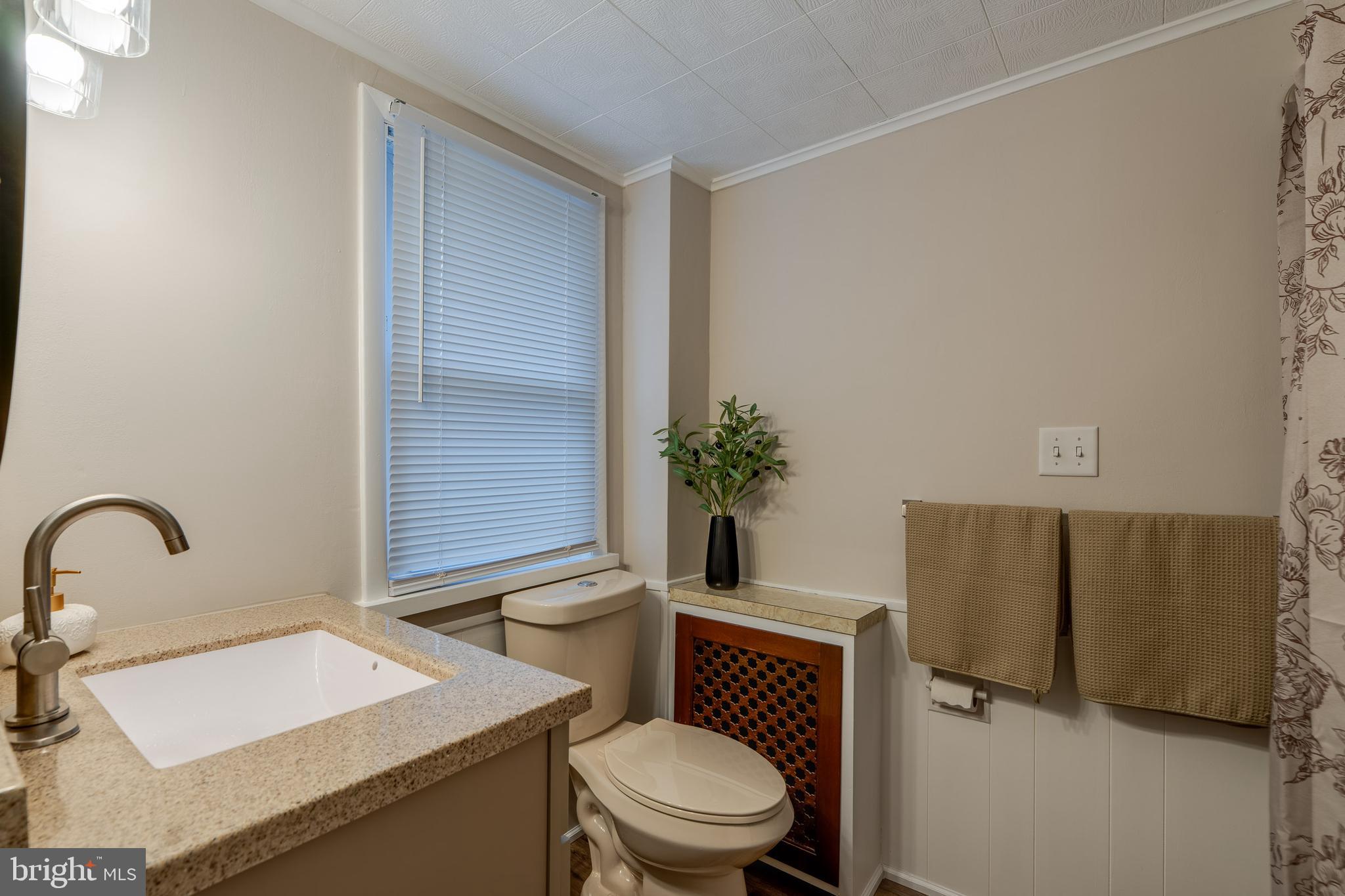 609 Lawn Reading, PA 19609 - Photo 25 of 34 a bathroom with a toilet a sink and mirror