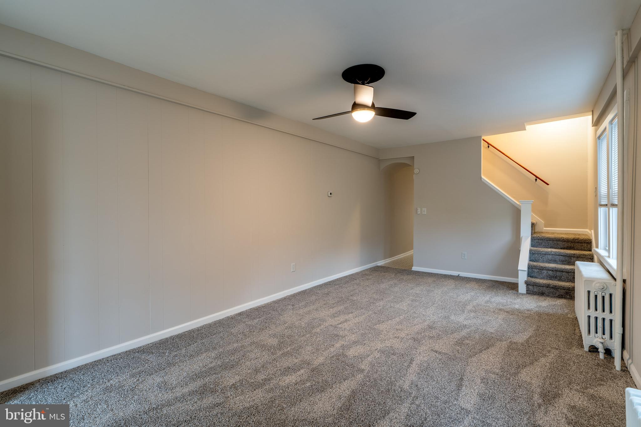 609 Lawn Reading, PA 19609 - Photo 9 of 34 an empty room with a ceiling fan and windows