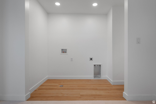 7238 South 525 East Midvale, UT 84047 - Photo 20 of 29 Dedicated utility space featuring bright recessed lighting and wood-finish flooring