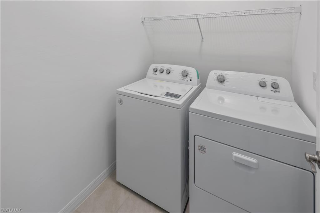 1093 Tranquil Brook Drive Naples, FL 34114 - Photo 16 of 22 a utility room with dryer and washer