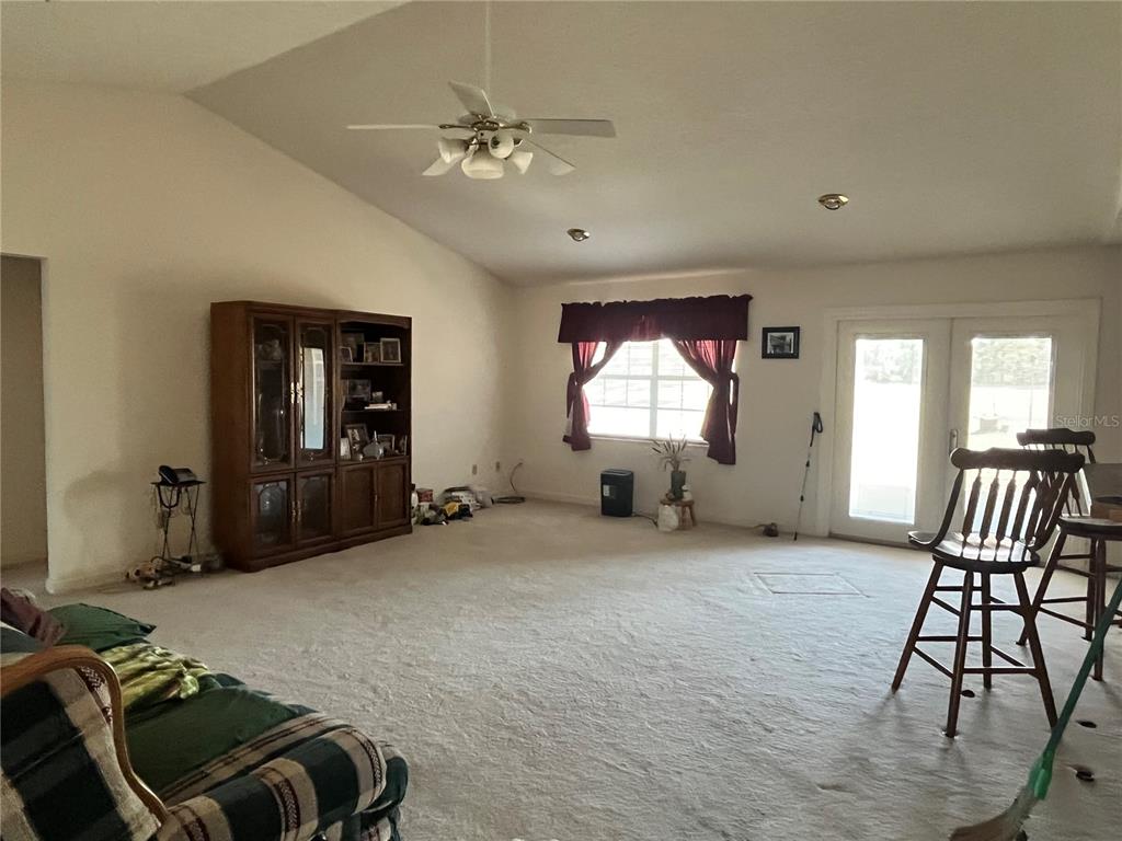 14182 Southwest 161st Street Brooker, FL 32622 - Photo 12 of 20 a bedroom with furniture and a window