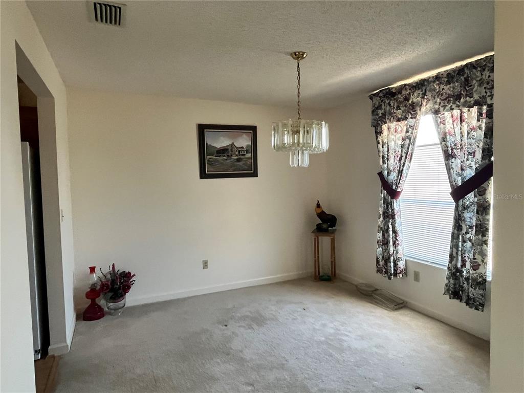 14182 Southwest 161st Street Brooker, FL 32622 - Photo 14 of 20 a view of an empty room with a window