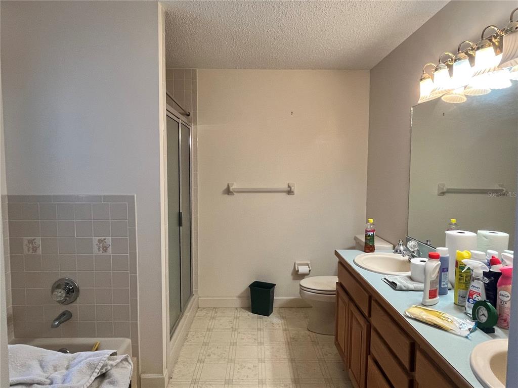 14182 Southwest 161st Street Brooker, FL 32622 - Photo 16 of 20 a bathroom with a sink a toilet and shower