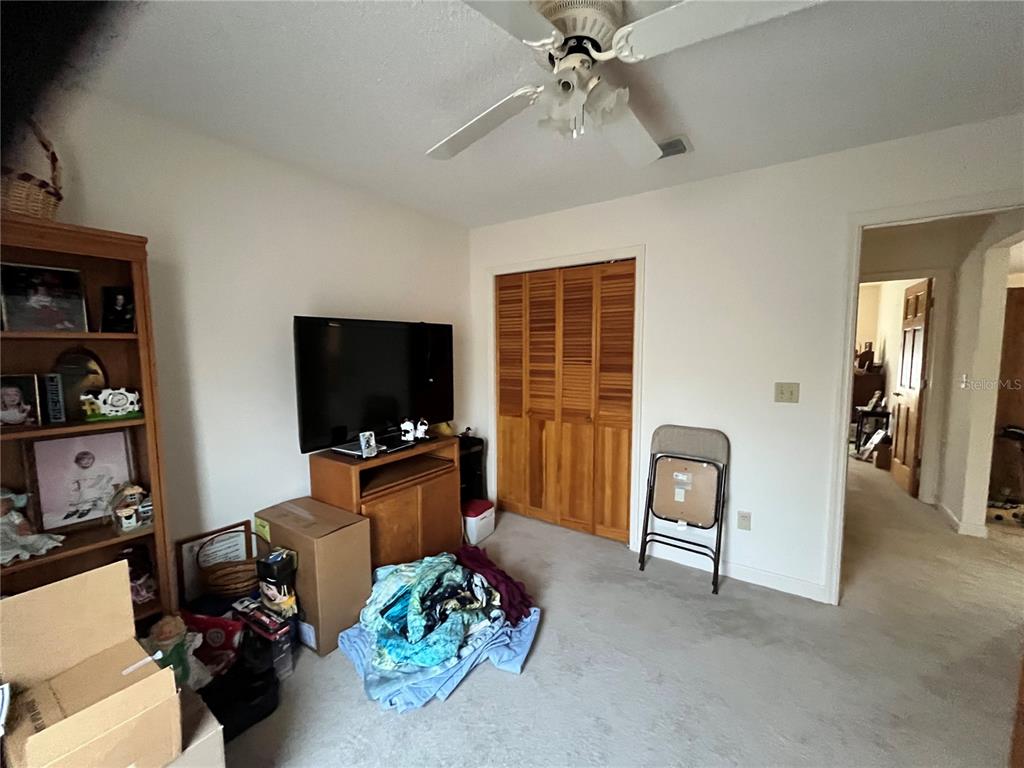 14182 Southwest 161st Street Brooker, FL 32622 - Photo 18 of 20 a living room with furniture and a flat screen tv