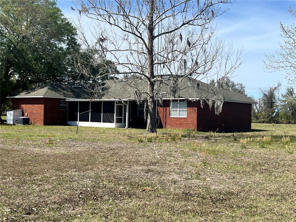 14182 Southwest 161st Street Brooker, FL 32622 - Photo 2 of 20 a house with trees in front of it