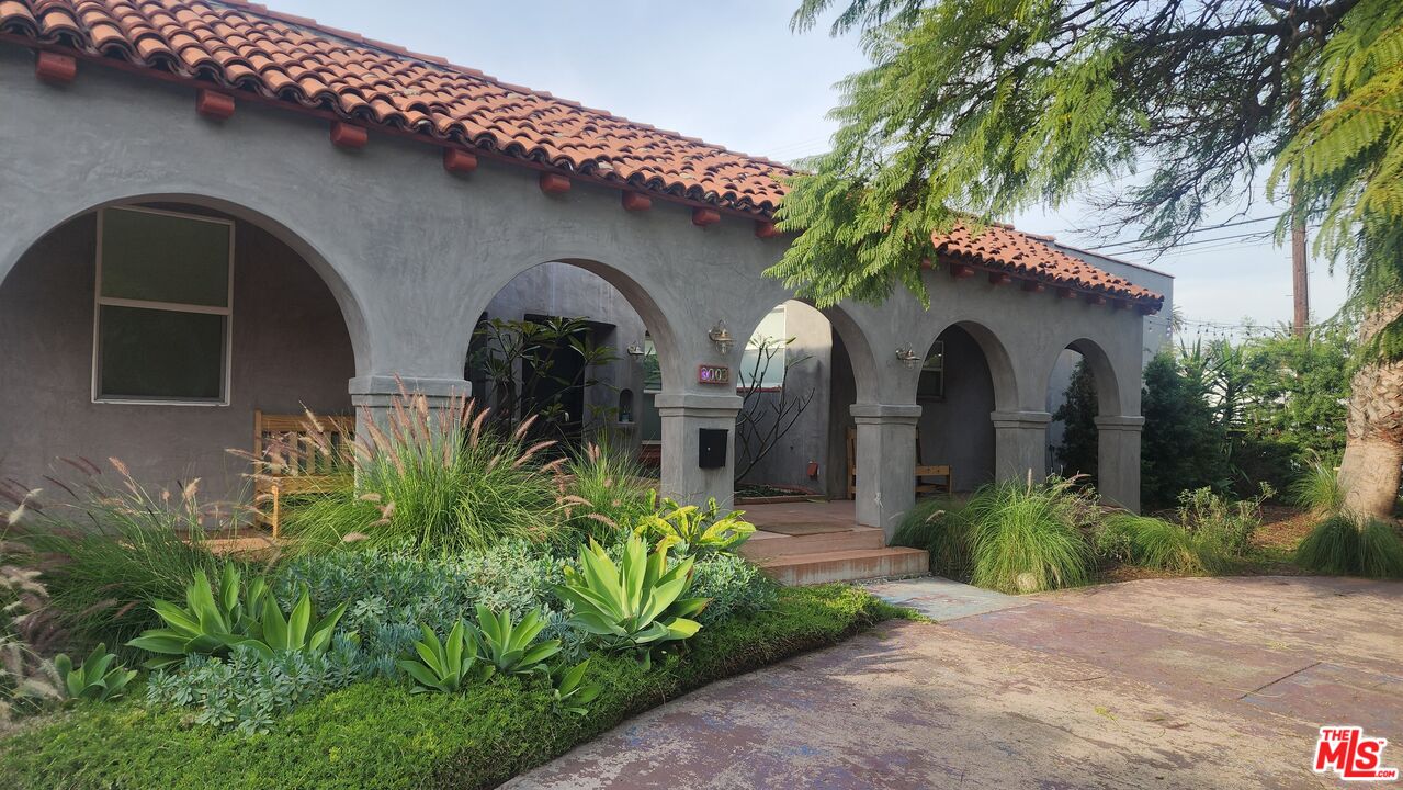3003 Vineyard Avenue Los Angeles, CA 90016 - Photo 1 of 6 a front view of house with yard