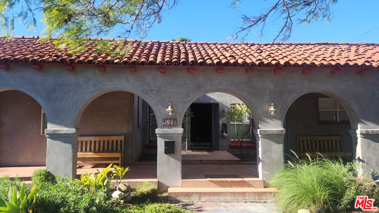 3003 Vineyard Avenue Los Angeles, CA 90016 - Photo 2 of 6 a front view of a house with plants