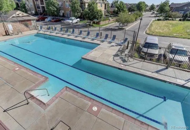 a view of a patio with chairs and table