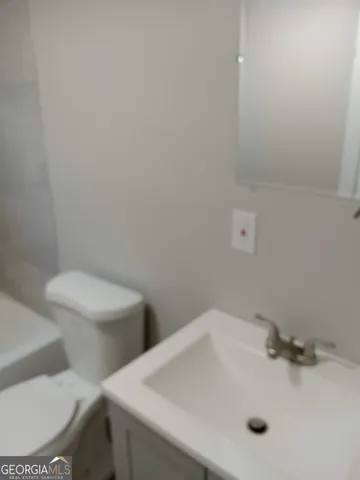 a bathroom with a sink and a toilet