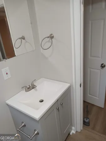 a bathroom with a sink and mirror