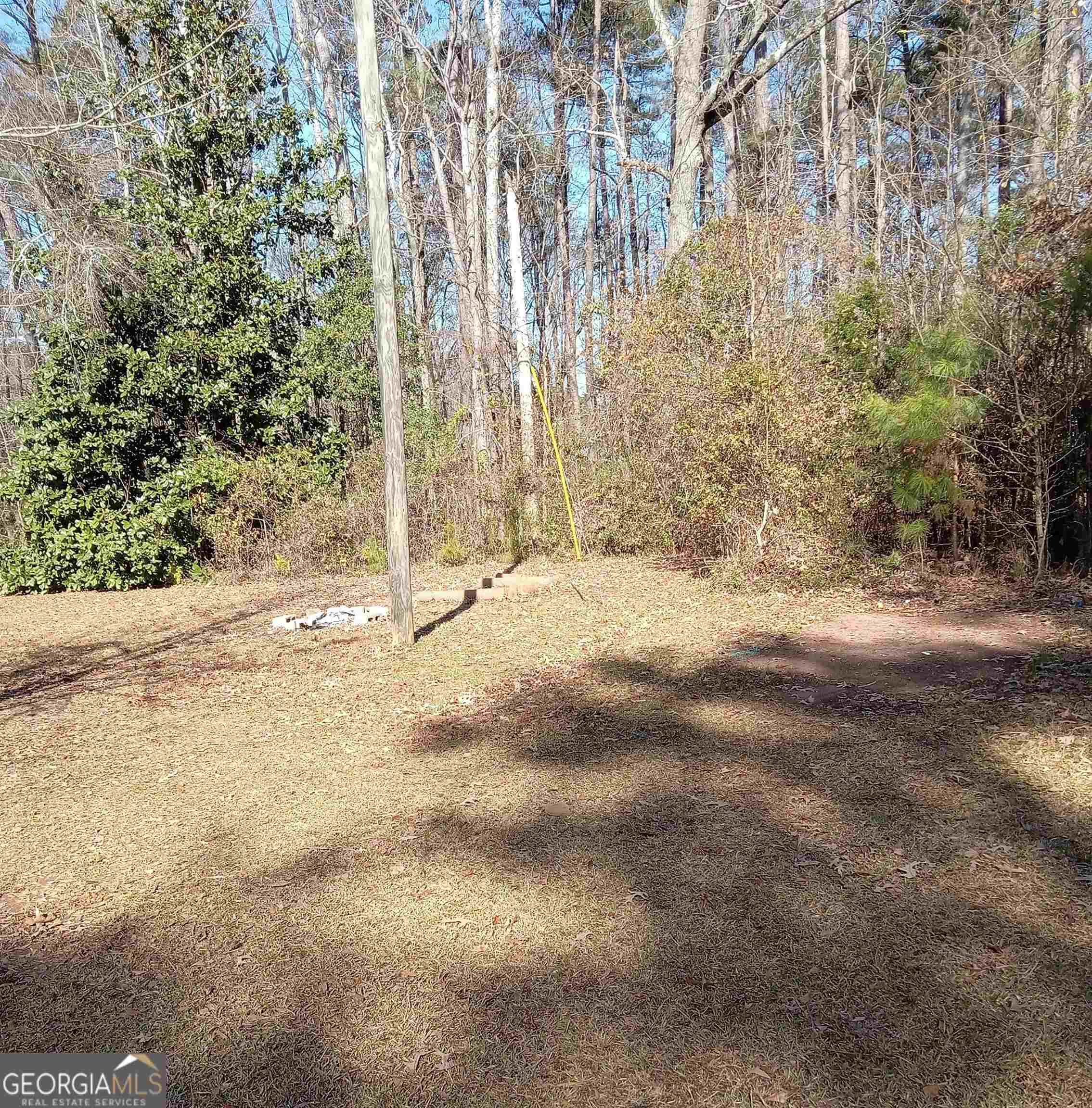 1186 Eastview Road Northeast Conyers, GA 30012 - Photo 20 of 20 a view of a yard with trees
