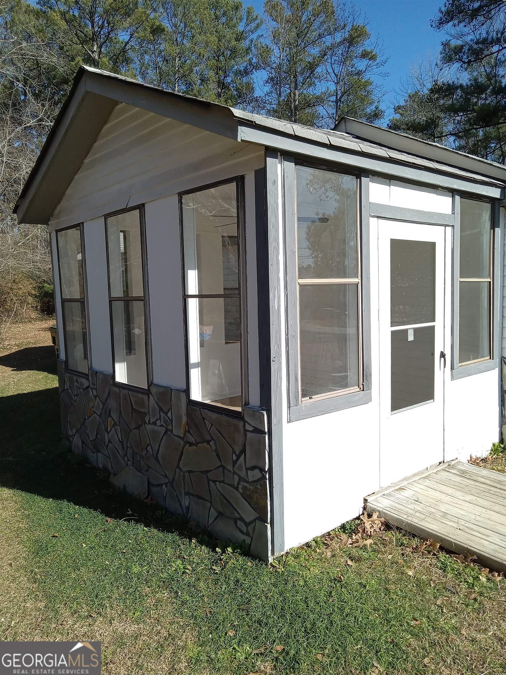 1186 Eastview Road Northeast Conyers, GA 30012 - Photo 2 of 20 a front view of a house with a yard