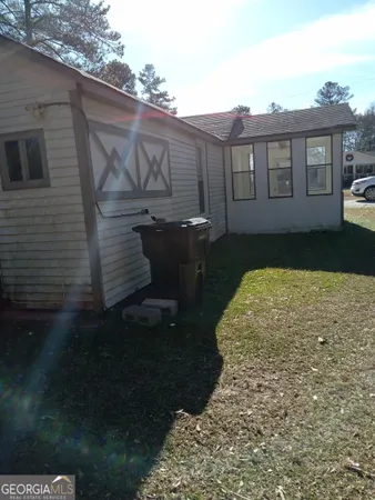 a view of a back yard of the house