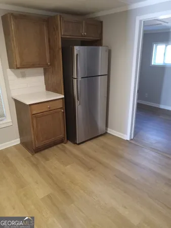 a kitchen with a refrigerator