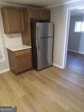 a kitchen with a refrigerator