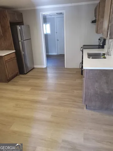 a view of a kitchen cabinets and wooden floor