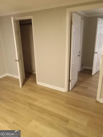 a view of entryway with wooden floor