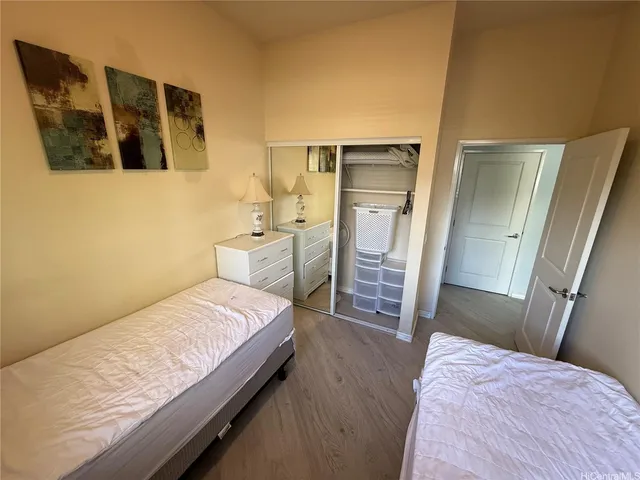 a bedroom with a bed and cabinets