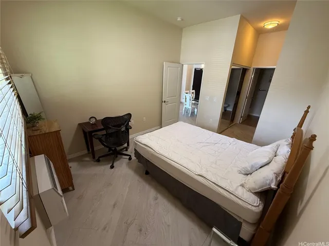 a bed room with a bed and furniture