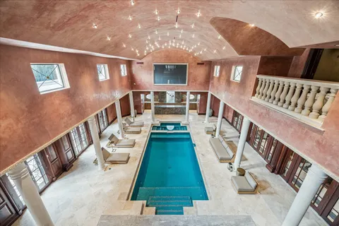 a bedroom with two beds and a flat screen tv