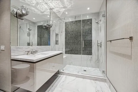 a view of a patio with couches and potted plants