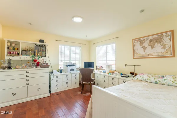 a bed room with a bed and a window