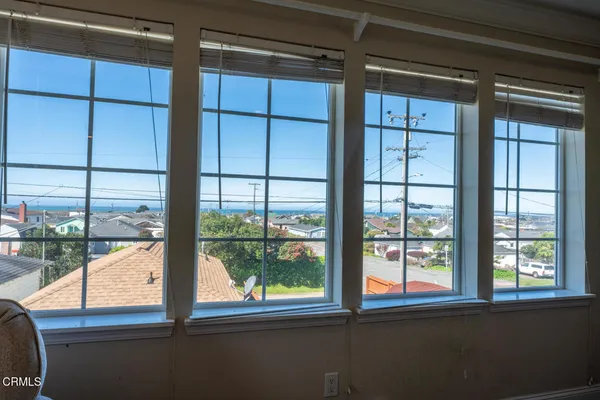 a view of a glass door with a view of the house