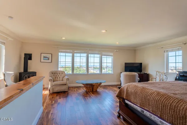 a bedroom with a bed and a couch