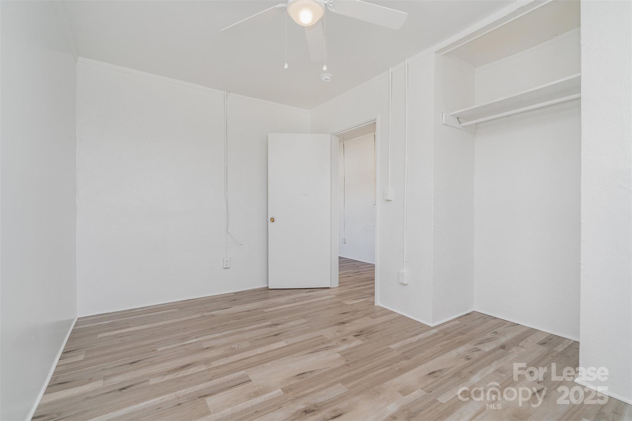 200 York Street, Unit F2 Chester, SC 29706 - Photo 11 of 16 a view of room with wooden floor and fan