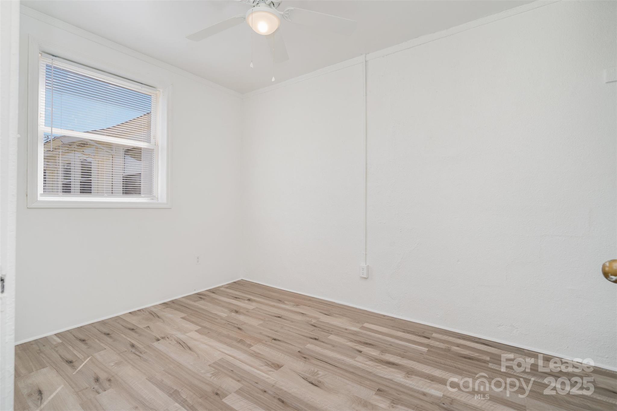 200 York Street, Unit F2 Chester, SC 29706 - Photo 12 of 16 a view of empty room with wooden floor
