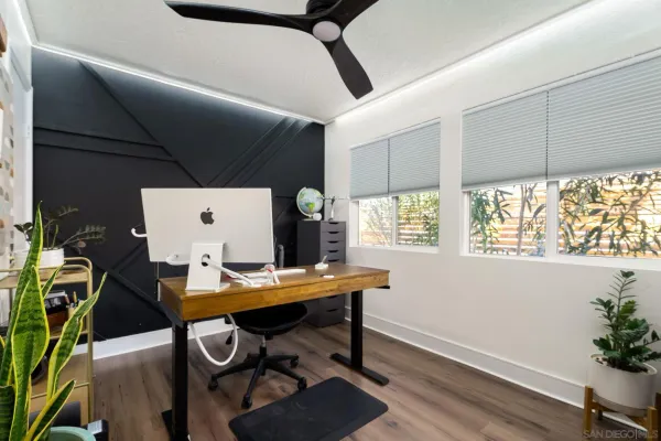 a workspace with furniture and window