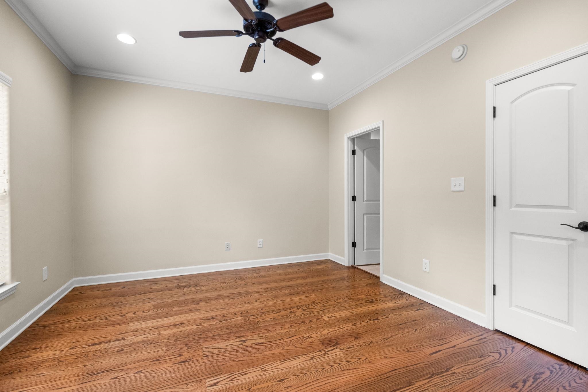2275 McVay Road, Unit 2275 Germantown, TN 38138 - Photo 14 of 40 an empty room with wooden floor and windows