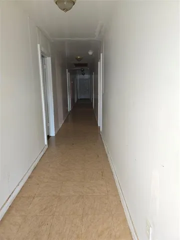 a view of empty room with windows