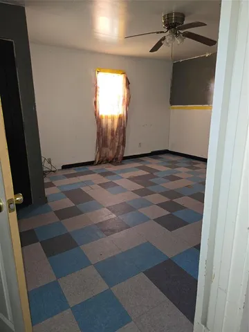 a view of walk in closet with empty room