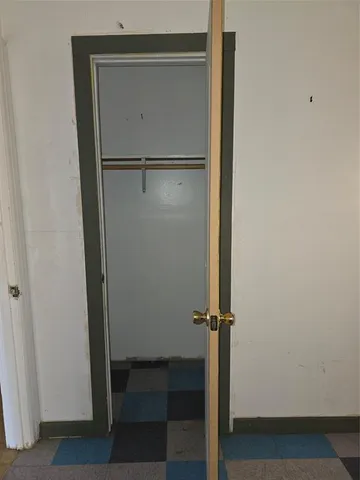 a view of a kitchen with a sink and window