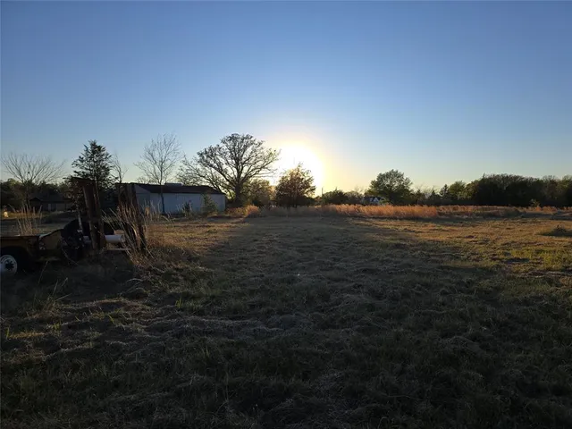 a living room with a rug and a rug